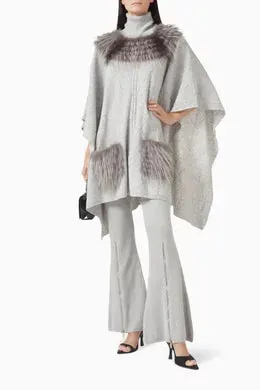 CABLE KNIT PONCHO WITH FUR NECKLINE AND POCKETS IN FOG
